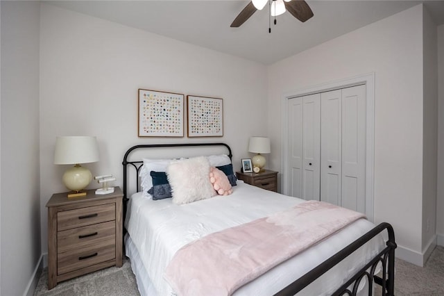 carpeted bedroom with a closet and ceiling fan