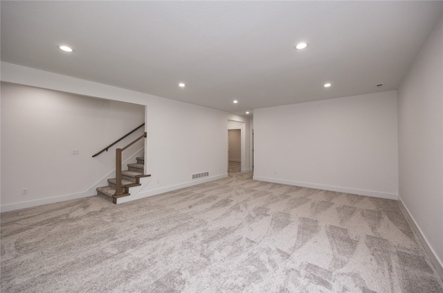 basement with light colored carpet