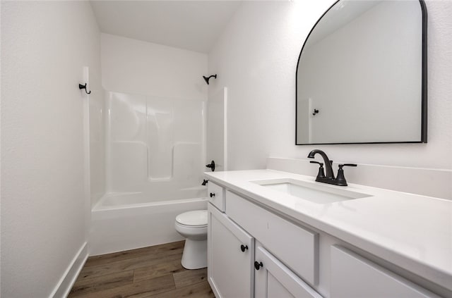 full bathroom with vanity, bathtub / shower combination, toilet, and hardwood / wood-style floors