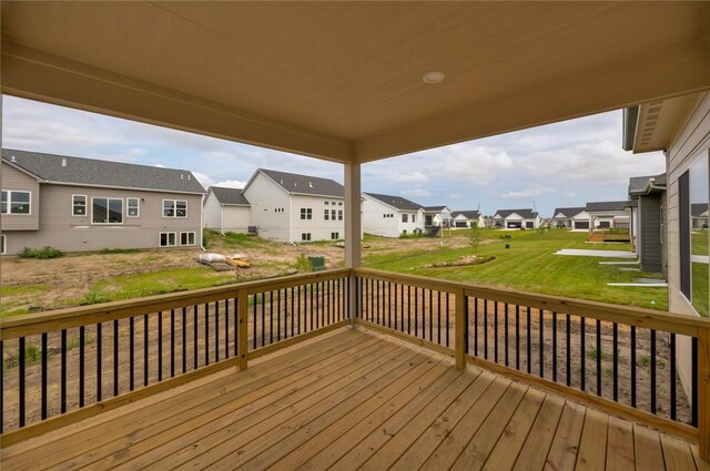 wooden deck featuring a yard