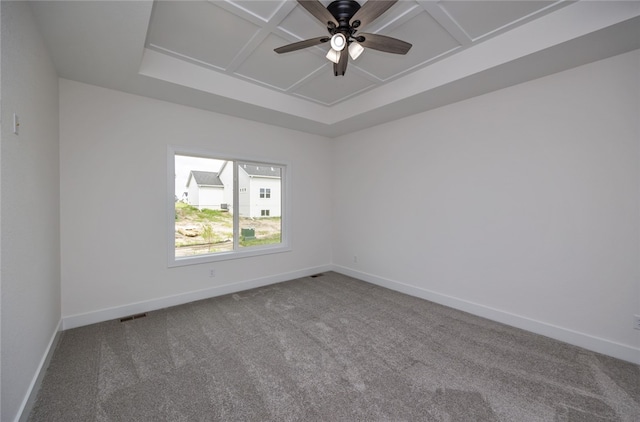 unfurnished room featuring carpet flooring, coffered ceiling, and ceiling fan