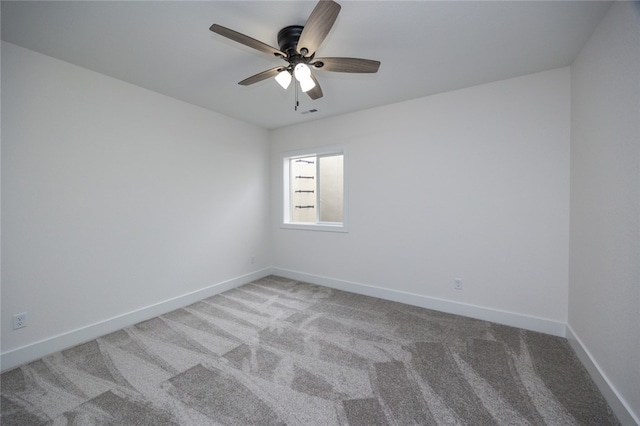 empty room featuring carpet and ceiling fan