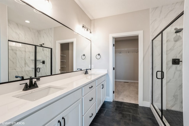 bathroom featuring vanity, tile patterned floors, and walk in shower