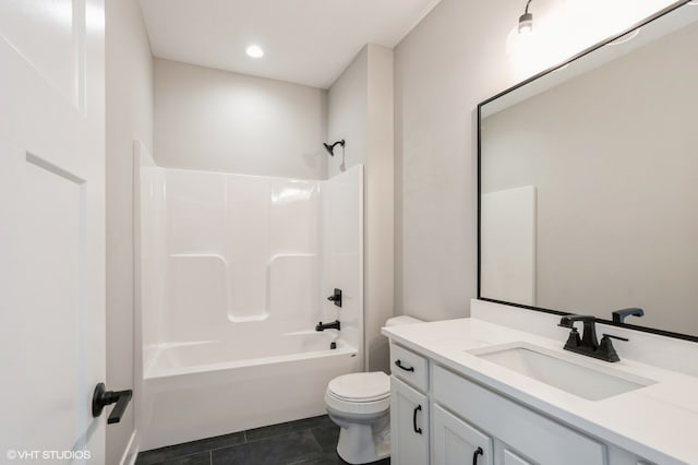 full bathroom with toilet, vanity, tile patterned floors, and washtub / shower combination