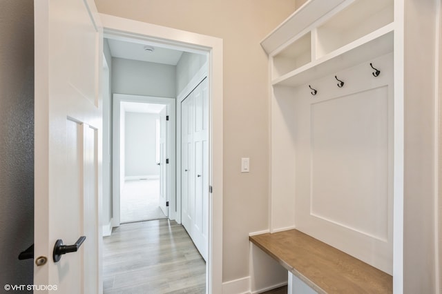 mudroom with light hardwood / wood-style floors