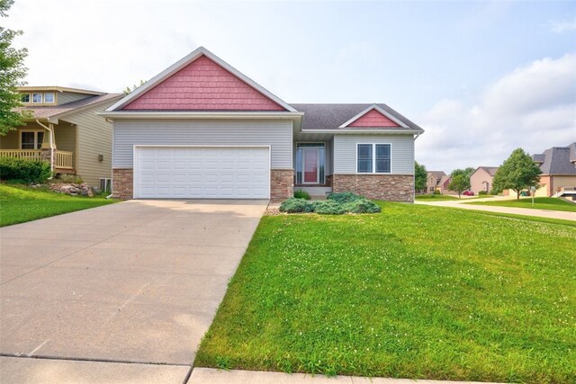 craftsman-style home with a garage and a front lawn