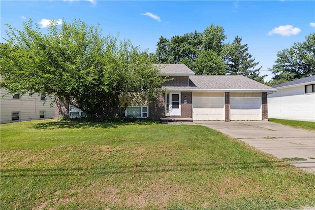 view of front of house featuring a garage and a front lawn