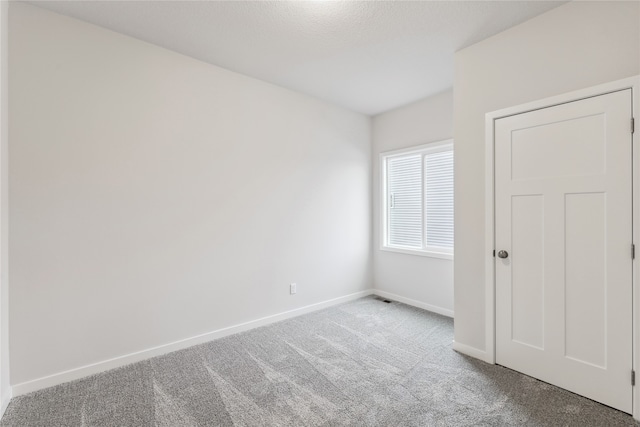 unfurnished room featuring carpet floors