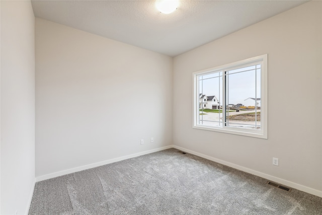 spare room featuring carpet flooring