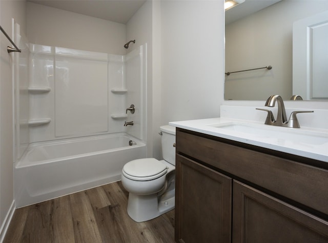 full bathroom featuring vanity, hardwood / wood-style floors,  shower combination, and toilet