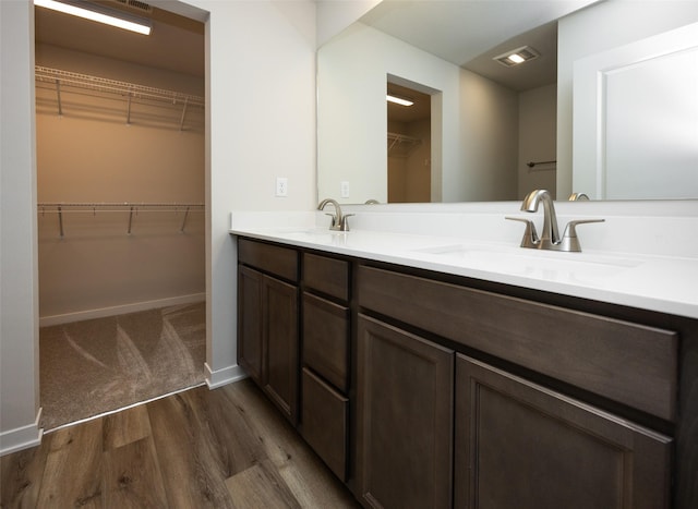 bathroom with vanity and hardwood / wood-style floors