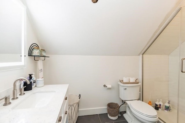 bathroom featuring tile patterned floors, toilet, vanity, and lofted ceiling