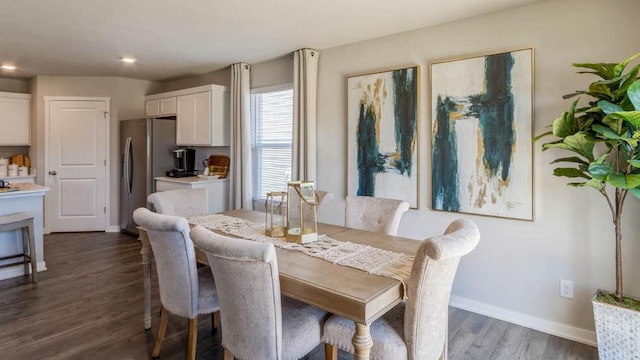 dining space featuring dark hardwood / wood-style floors