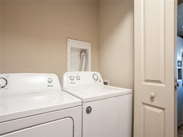 washroom featuring washer and clothes dryer