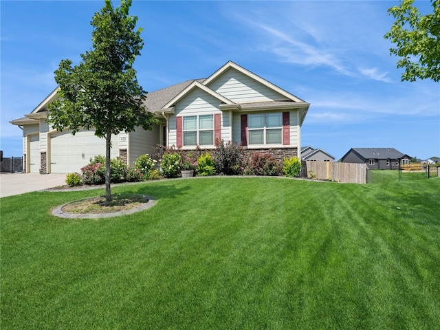 view of front of house with a garage and a front lawn