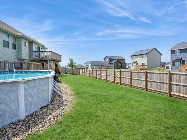 view of yard featuring a swimming pool side deck