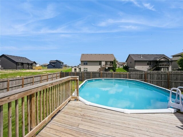 view of swimming pool with a wooden deck