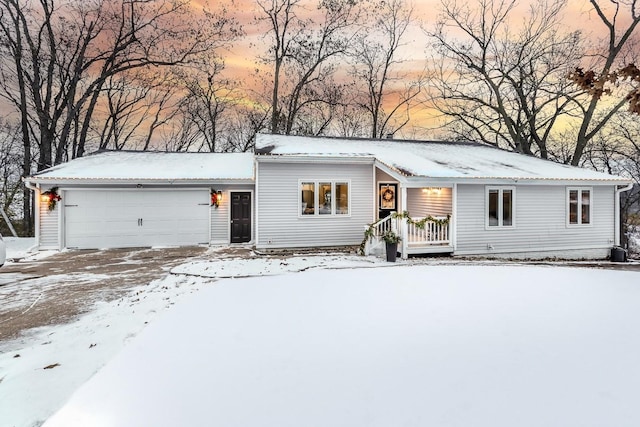 ranch-style home with central AC and a garage