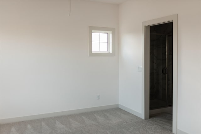 127 N 36th St, Cumming, IA 50061 - unfurnished bedroom featuring carpet floors and baseboards