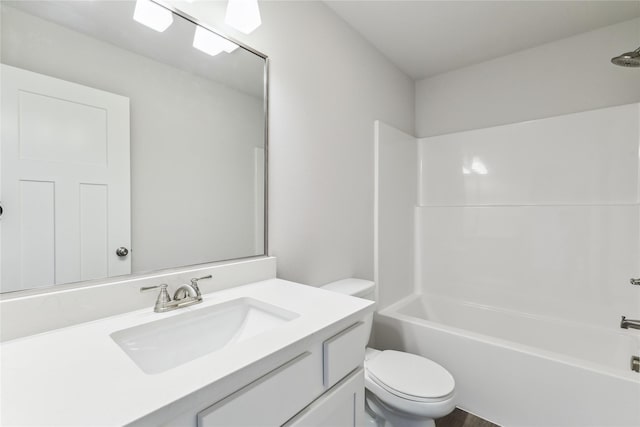 full bath featuring vanity, washtub / shower combination, and toilet