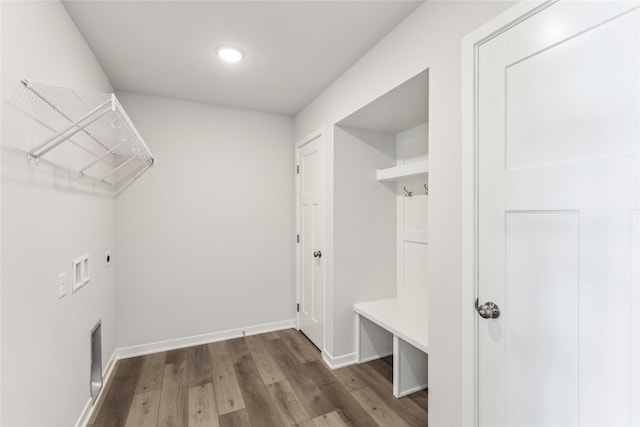 interior space with baseboards, recessed lighting, and wood finished floors