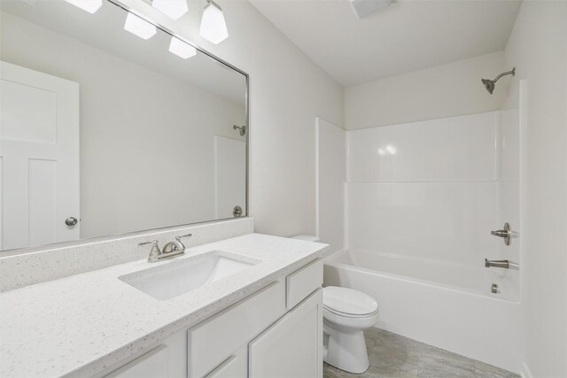 full bathroom featuring shower / tub combination, tile patterned flooring, vanity, and toilet