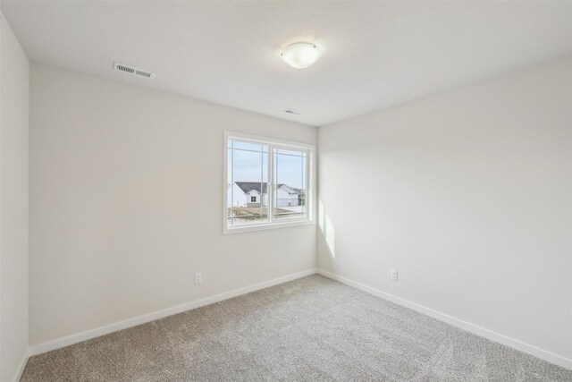 empty room with carpet flooring