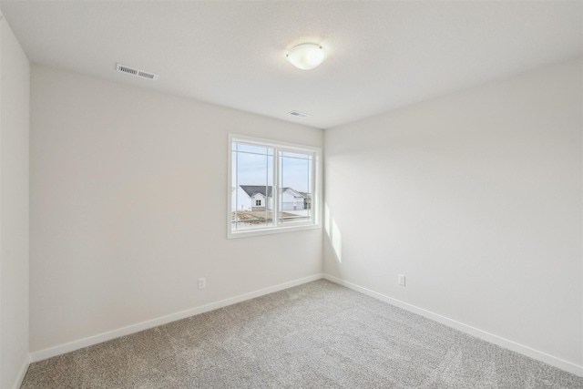 empty room with carpet flooring