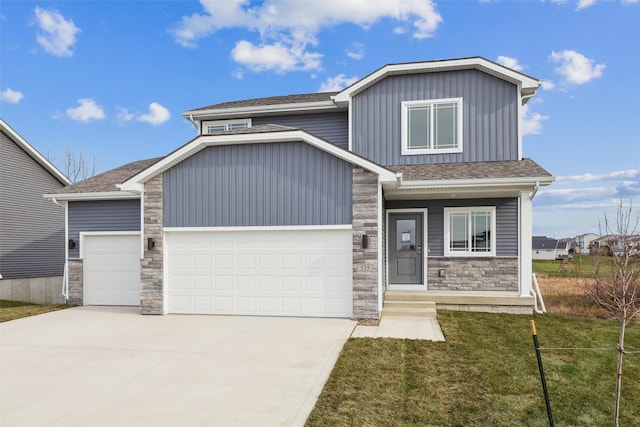 view of front facade with a front yard and a garage