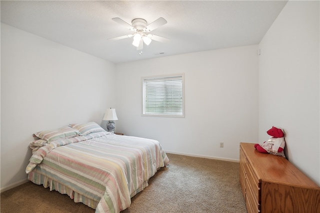 bedroom with ceiling fan and light carpet