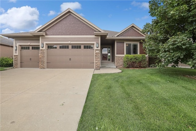 craftsman-style home with a front lawn and a garage