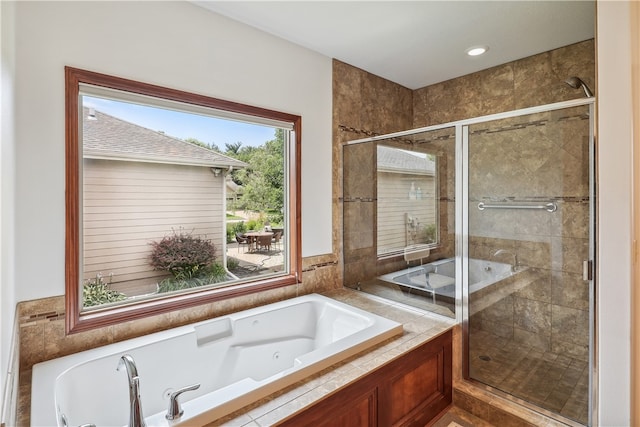 bathroom featuring plus walk in shower