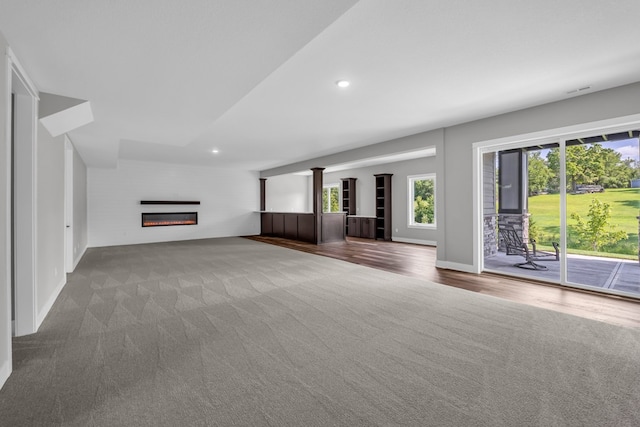 unfurnished living room featuring carpet floors