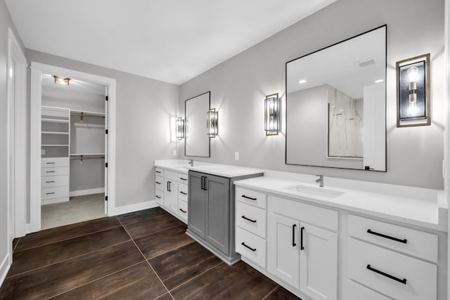 bathroom featuring double vanity and tile patterned floors