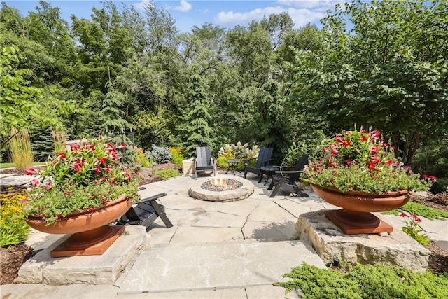 4701 150th St, Urbandale, IA 50323 - view of patio / terrace featuring an outdoor fire pit
