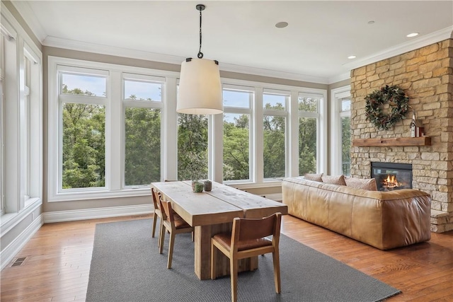 4701 150th St, Urbandale, IA 50323 - sunroom / solarium featuring ornamental molding, plenty of natural light, wood finished floors, and baseboards