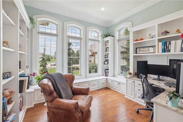 4701 150th St, Urbandale, IA 50323 - office featuring built in study area, crown molding, and light wood finished floors