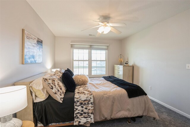 carpeted bedroom with a ceiling fan, visible vents, and baseboards