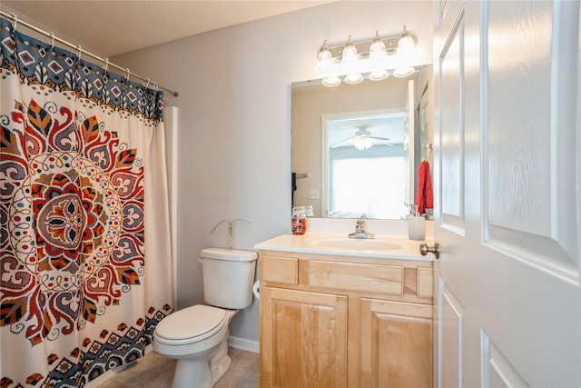 bathroom with tile patterned flooring, curtained shower, toilet, and vanity