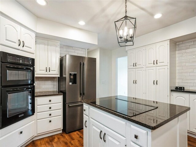 kitchen featuring black appliances, tasteful backsplash, dark hardwood / wood-style flooring, white cabinets, and a kitchen island