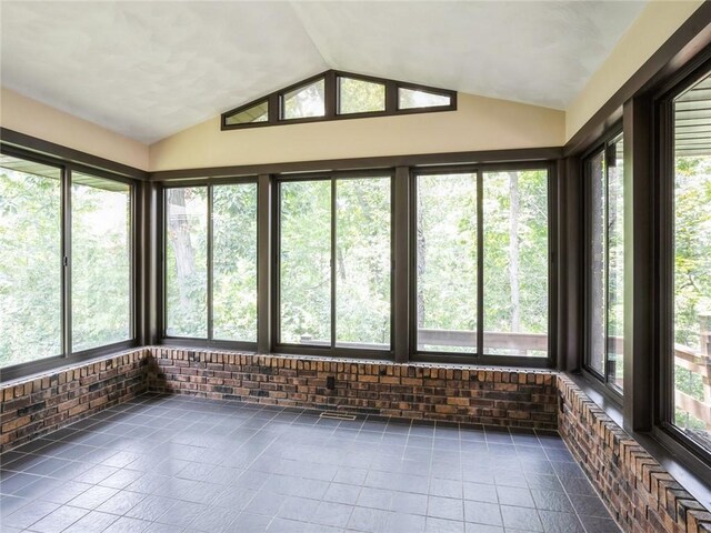 unfurnished sunroom with vaulted ceiling