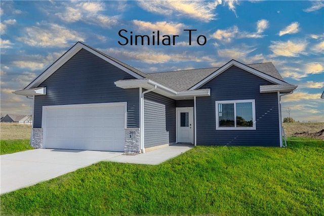 ranch-style home with a garage and a front yard