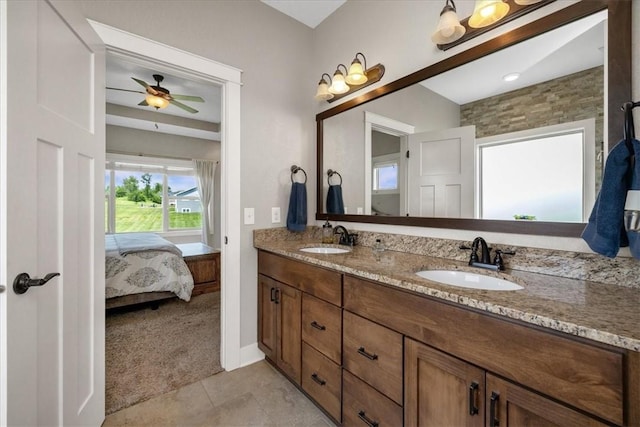 bathroom with tile patterned floors, double vanity, and ceiling fan