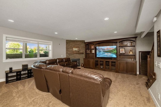 interior space featuring a stone fireplace and a textured ceiling