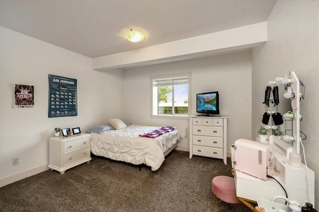 bedroom featuring dark carpet