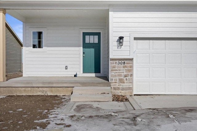 entrance to property featuring a garage