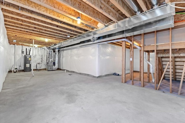 basement featuring electric water heater and heating unit