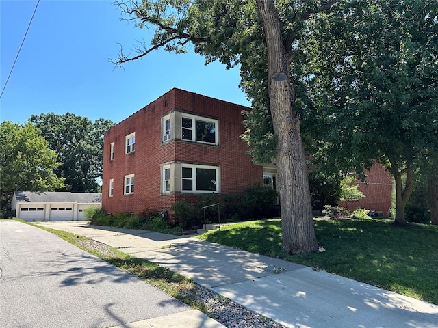 view of front of property with a garage and a front yard