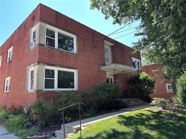 view of home's exterior featuring a yard