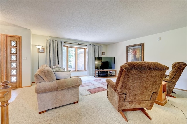 living room featuring light colored carpet and a textured ceiling